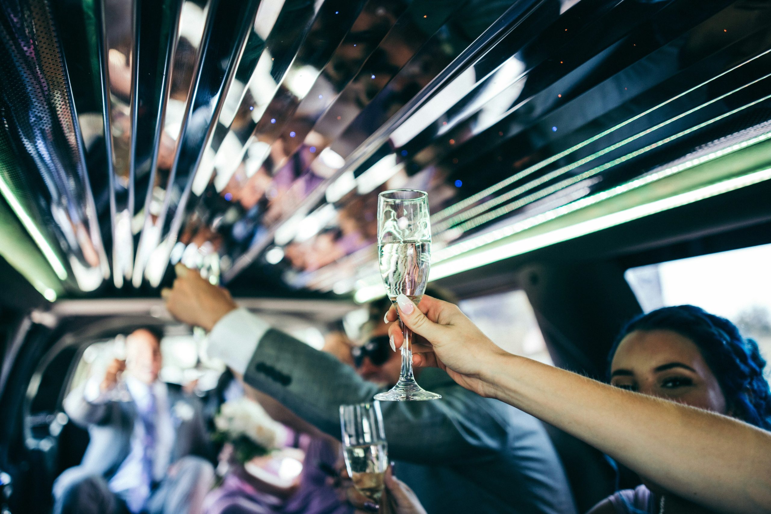 Young people drinking champagne in Las Vegas limo